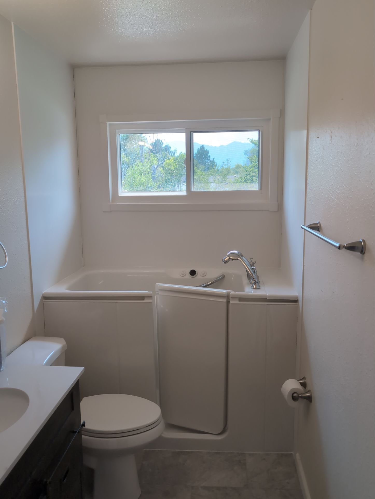 Walk-in bathtub installation in a Colorado Springs bathroom on Anjelina Circle designed for safety and accessibility with easy-entry door and built-in seat