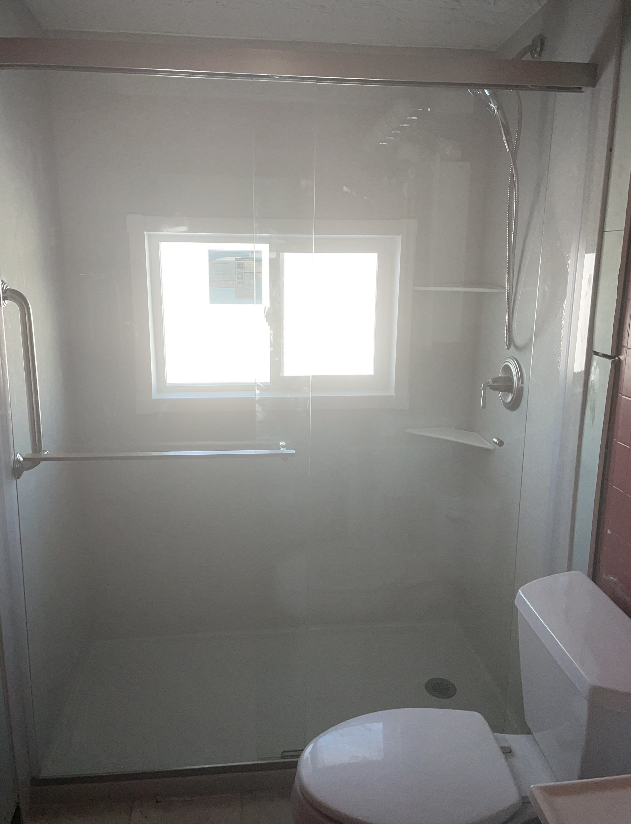 Modern walk-in shower replacement with sliding glass doors in a La Plata County, Colorado home