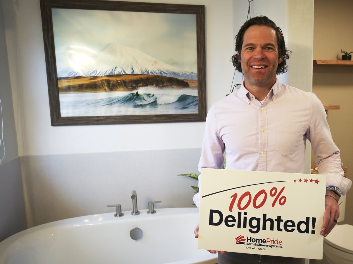 Homeowner Donnie Haubert holding a 
