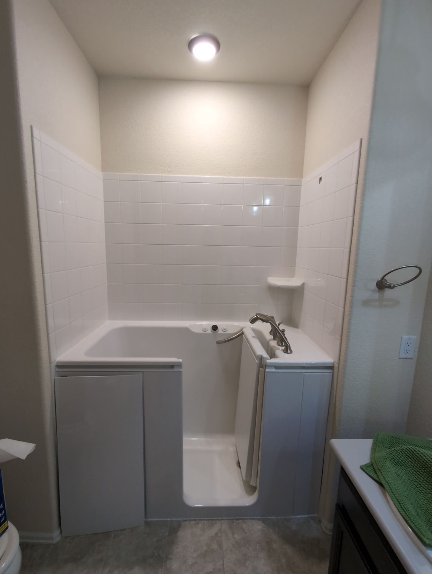 Bathroom remodeling project on E 151st Place in Thornton showcasinwalk-in tub, and accessibility-focused design upgrades.