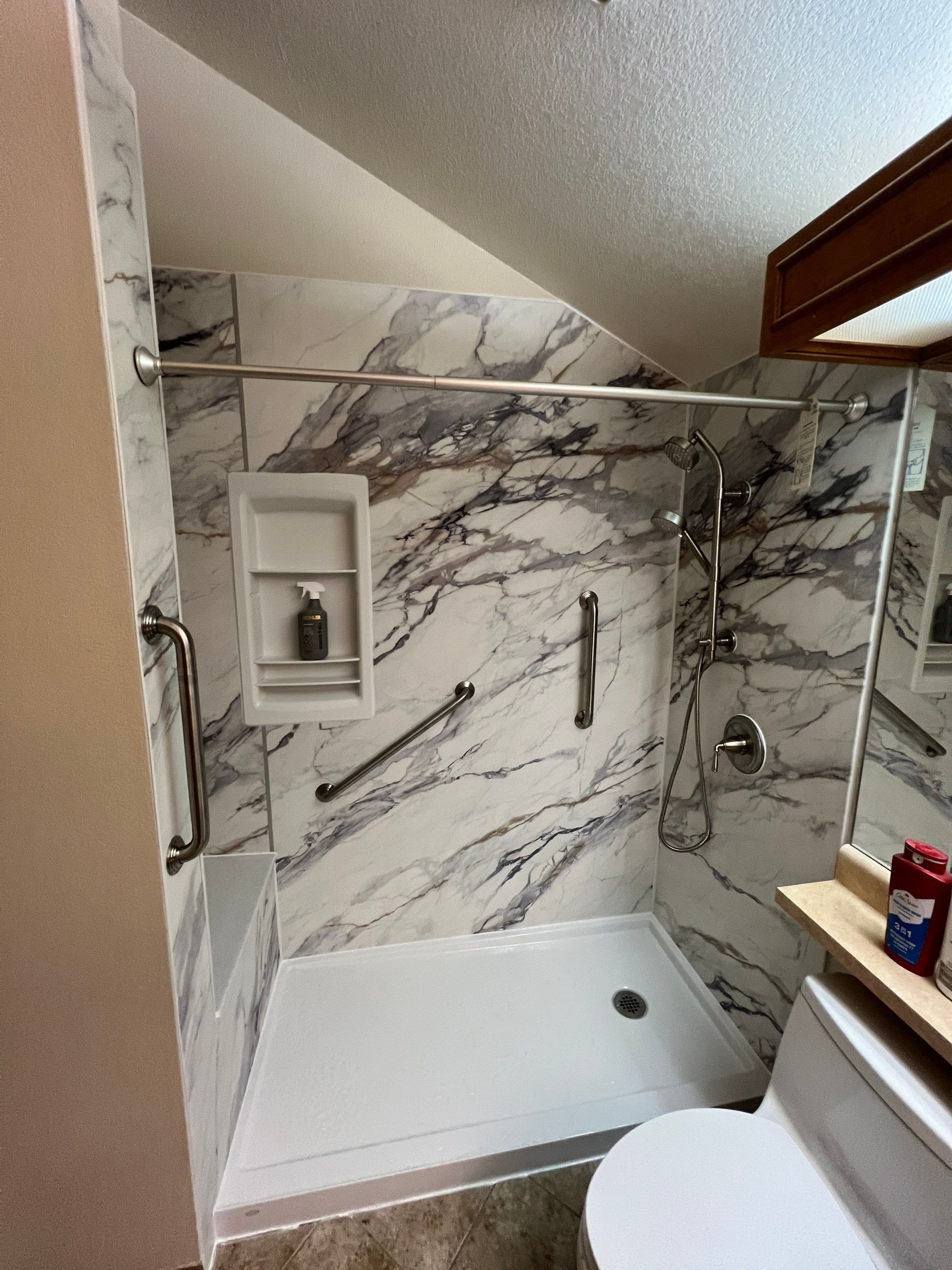 Bathroom renovation on Garfield Way in Thornton with a tub replacement, updated plumbing fixtures, and materials designed to handle Front Range hard water.