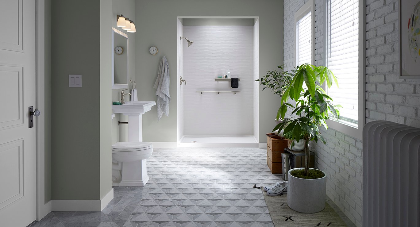 KOHLER walk-in shower with white brick tile, pedestal sink, and organic modern bathroom design