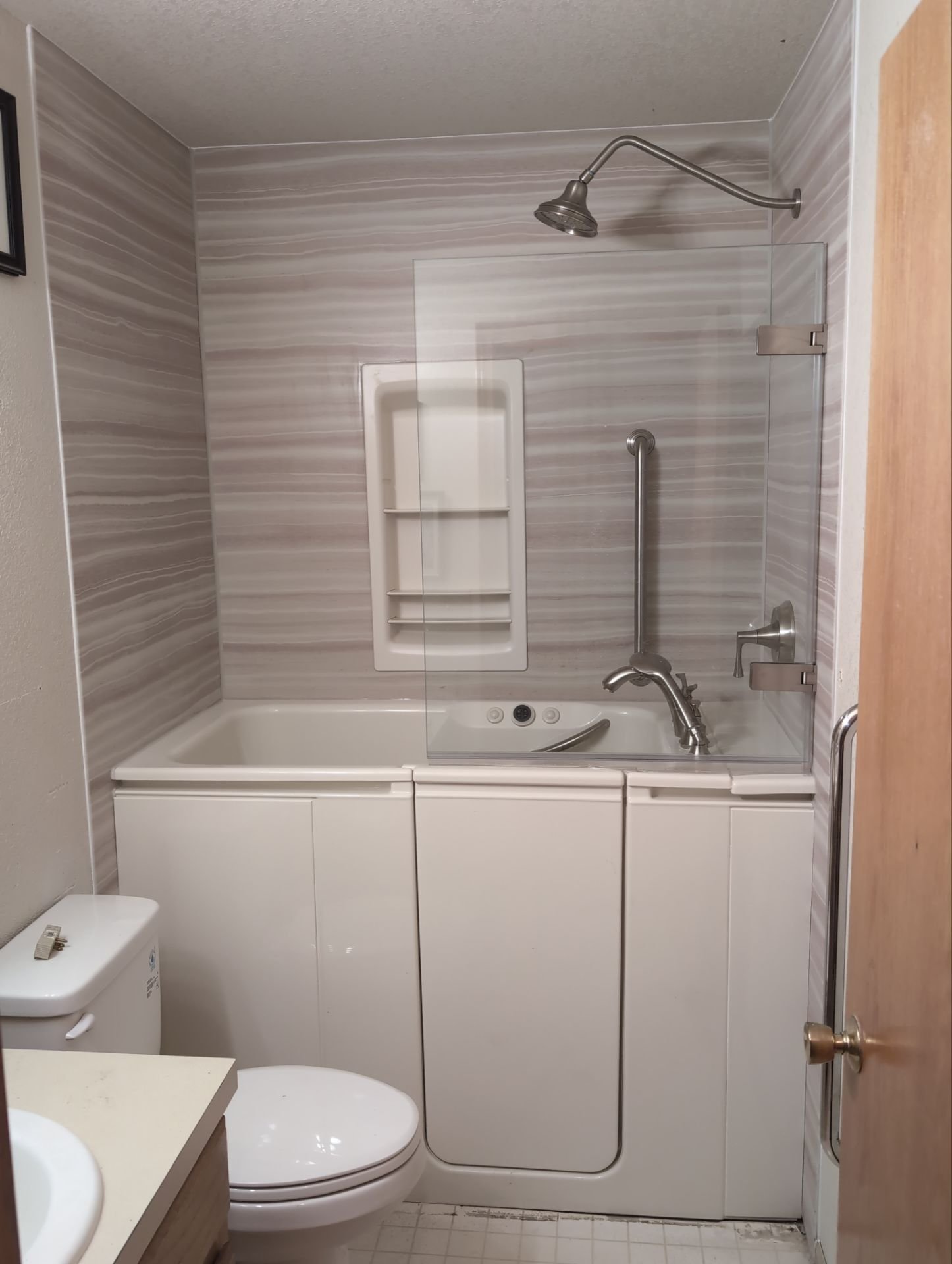 Fully accessible walk-in tub and shower combo installed in Fort Collins, CO for safe senior bathing