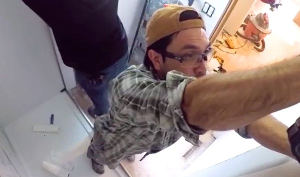 HomePride Bath installer working inside shower remodel with protective floor covering