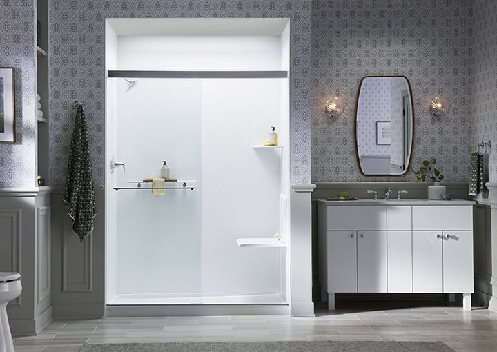 KOHLER LuxStone walk-in shower with built-in seating and glass door in Denver, Colorado remodel