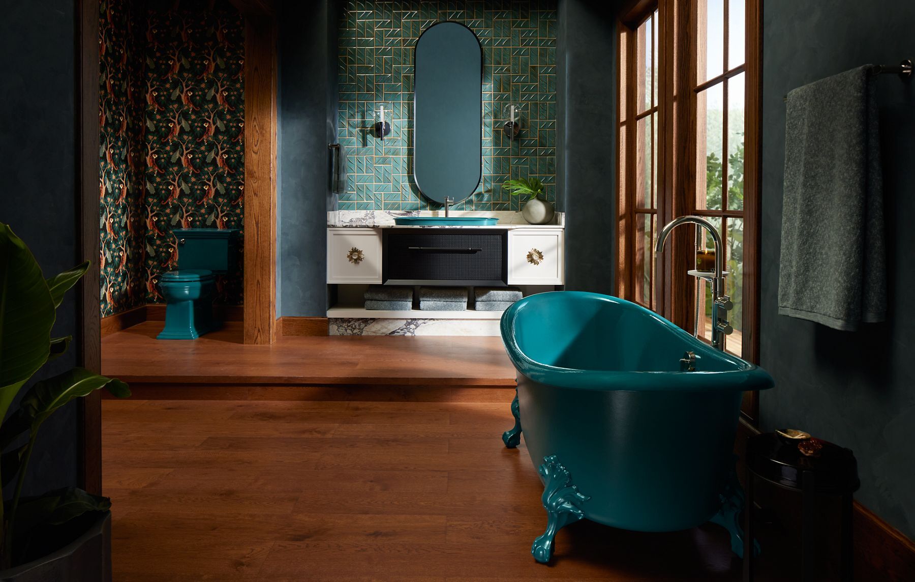 Luxury bathroom remodel in Denver with teal clawfoot tub, patterned wallpaper, and modern vanity