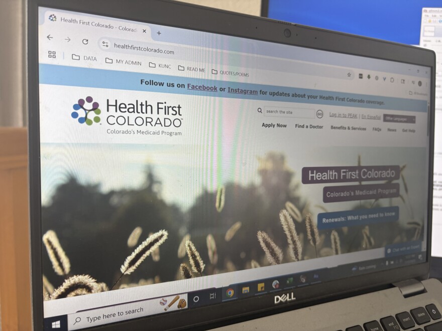 Health First Colorado Medicaid website displayed on a laptop screen, highlighting Colorado Medicaid resources for home modifications and accessibility benefits.