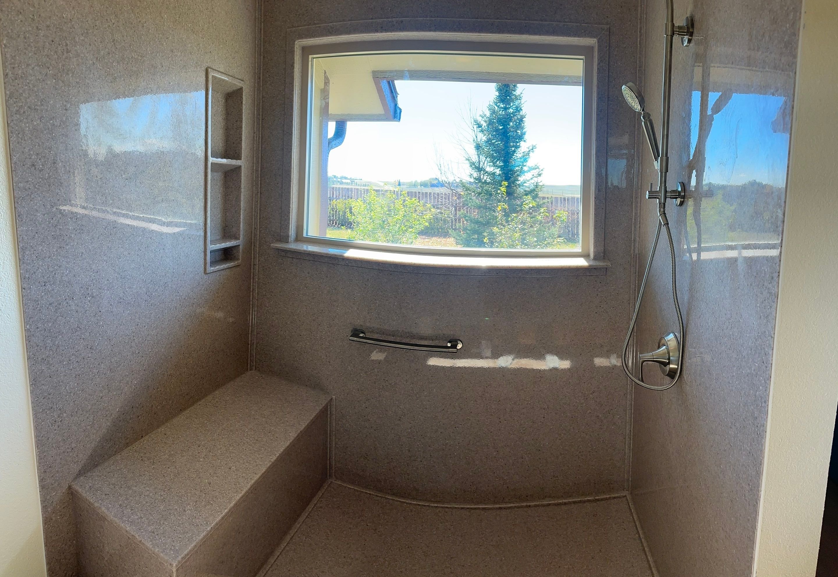 Cheyenne bathroom upgrade on Milliron Road featuring walk-in shower, sliding glass enclosure, and improved ventilation for moisture control