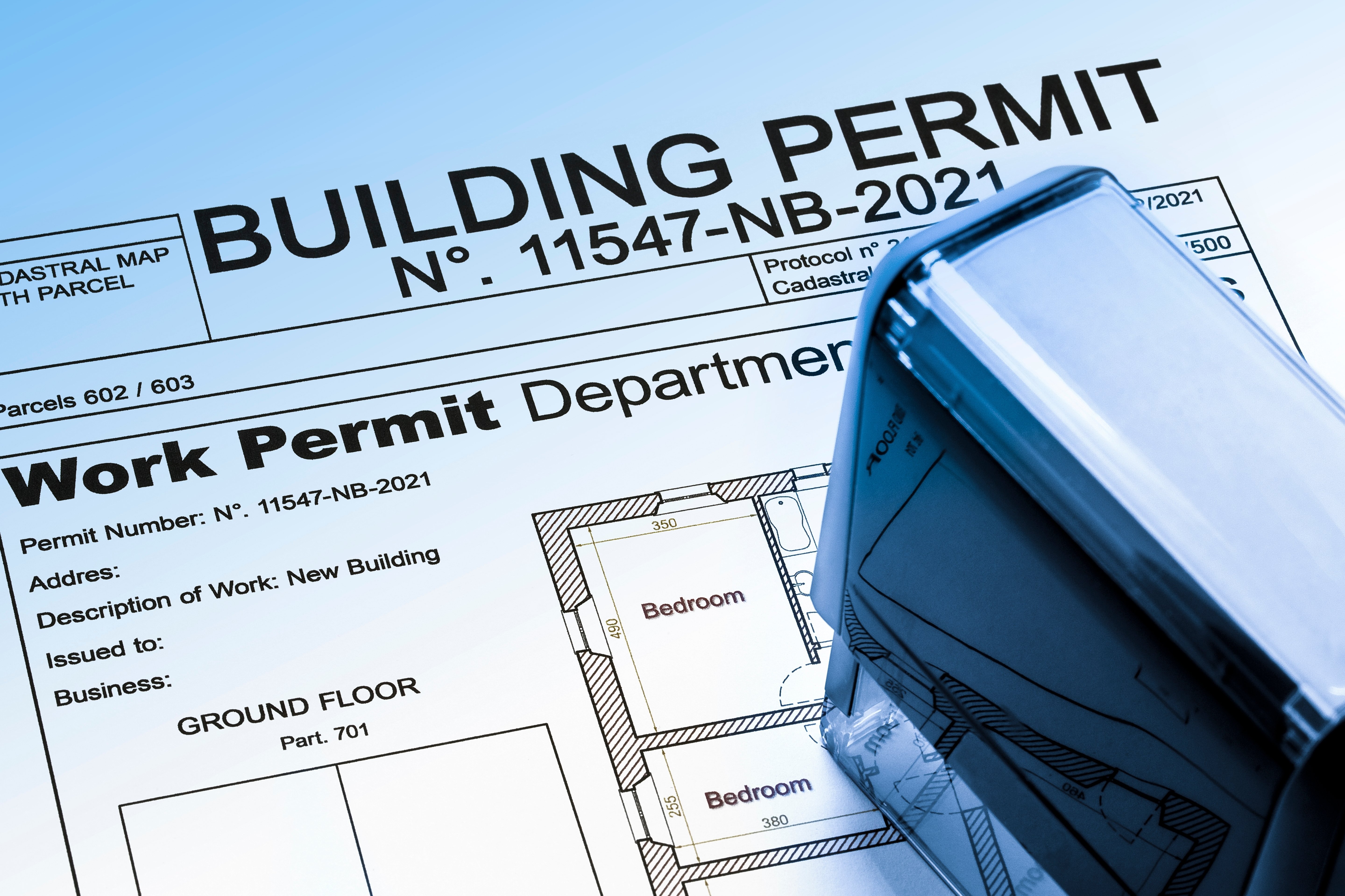 Building permit and floor plan documents for a Colorado bathroom remodel project, illustrating official approval for renovation work.
