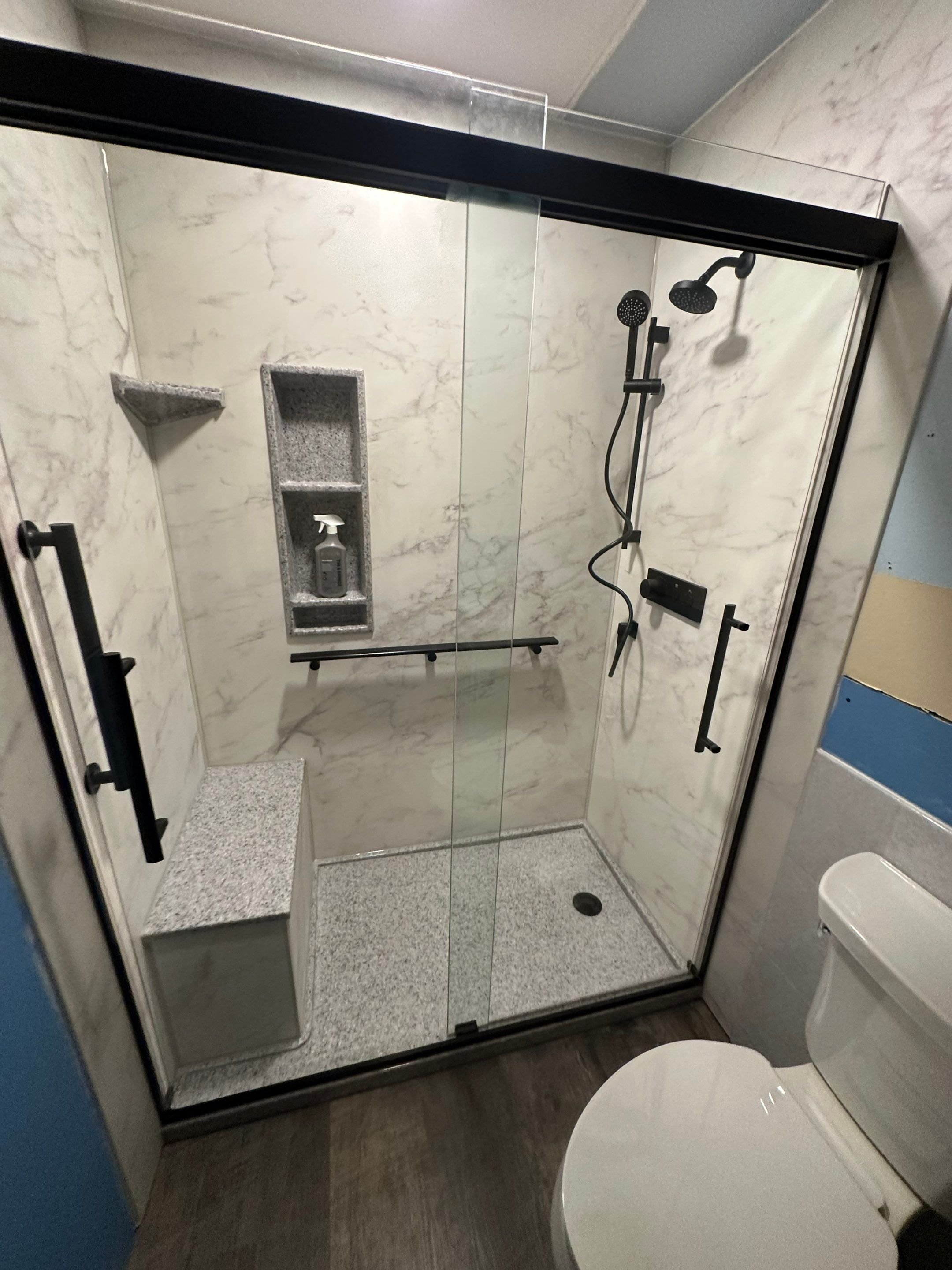 Bathtub replacement in a Colorado Springs bathroom on Shasta Drive with clean white wall panels, updated fixtures, and improved ease of use