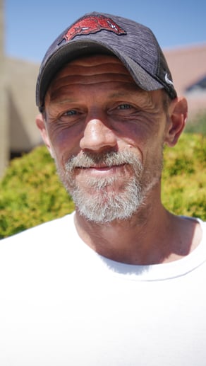 Tyson Fox smiling outdoors after his new walk-in shower installation by HomePride Bath in Pueblo, Colorado