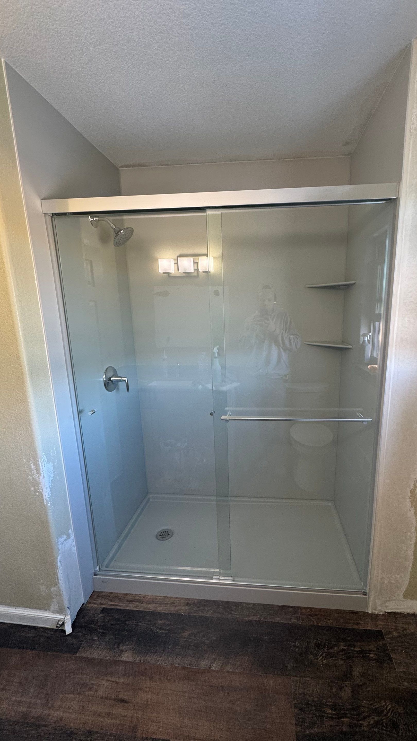 Shower replacement in Pagosa Springs on Tiffany Place featuring a low-threshold shower base, glass enclosure, and easy-clean wall system