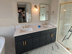 Image of a HomePride full bathroom remodel completed in Parker, CO, complete with vanity, new flooring, standalone tub and walk-in shower.