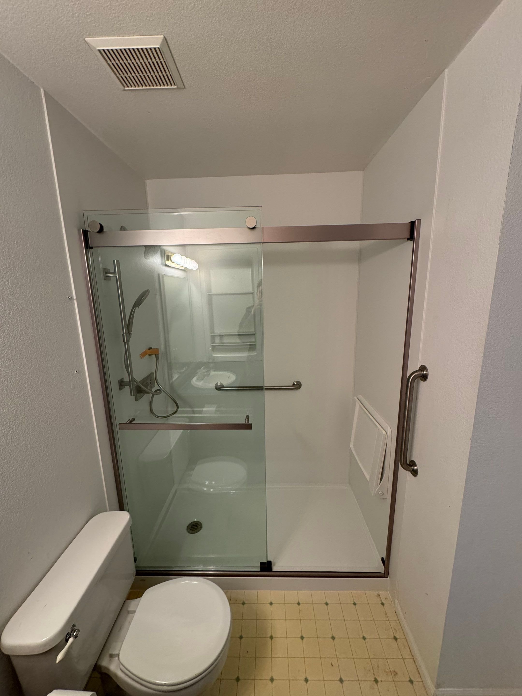 Accessible walk-in shower remodel on Treadway Trail in Cheyenne, Wyoming with grab bars, wide entry, and durable wall panels