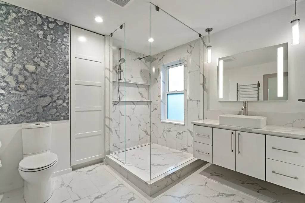 KOHLER LuxStone walk-in shower with marble-look walls in modern Colorado Springs bathroom remodel