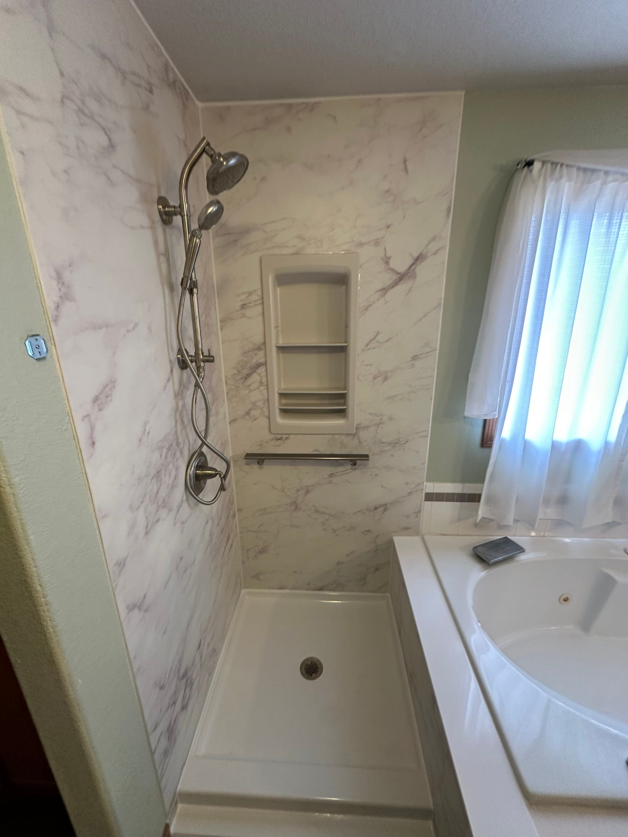 Custom bathroom remodel on Willow Creek Drive in Fort Collins combining a walk-in shower and accessible soaking tub for long-term comfort